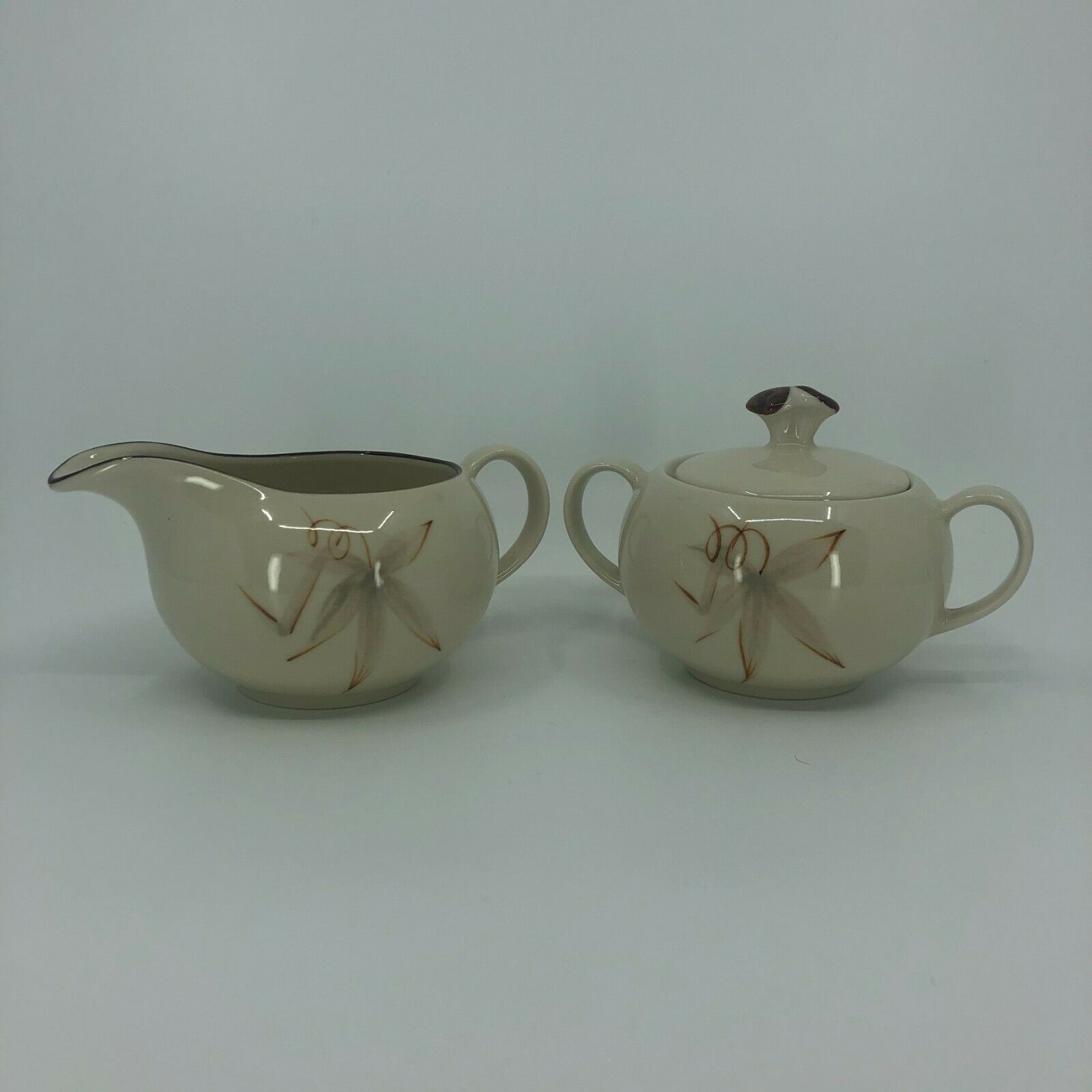 Winfield Pottery Company Cream And Sugar Set In Passion Flower Pattern